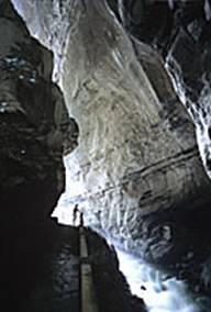 Daylight barely reaches the narrowest parts of the wild Tamina river canyon.