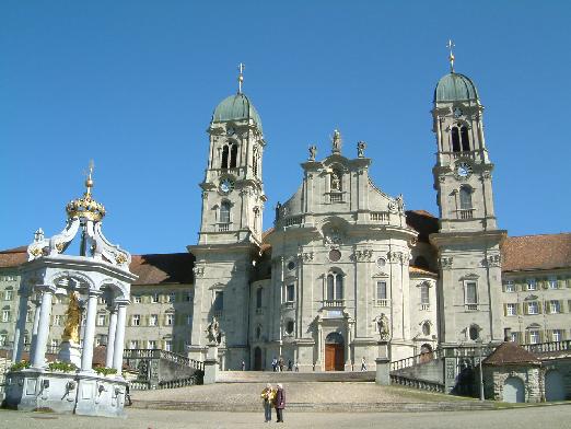The baroque cathedral of Einsiedeln with the ladies fountain